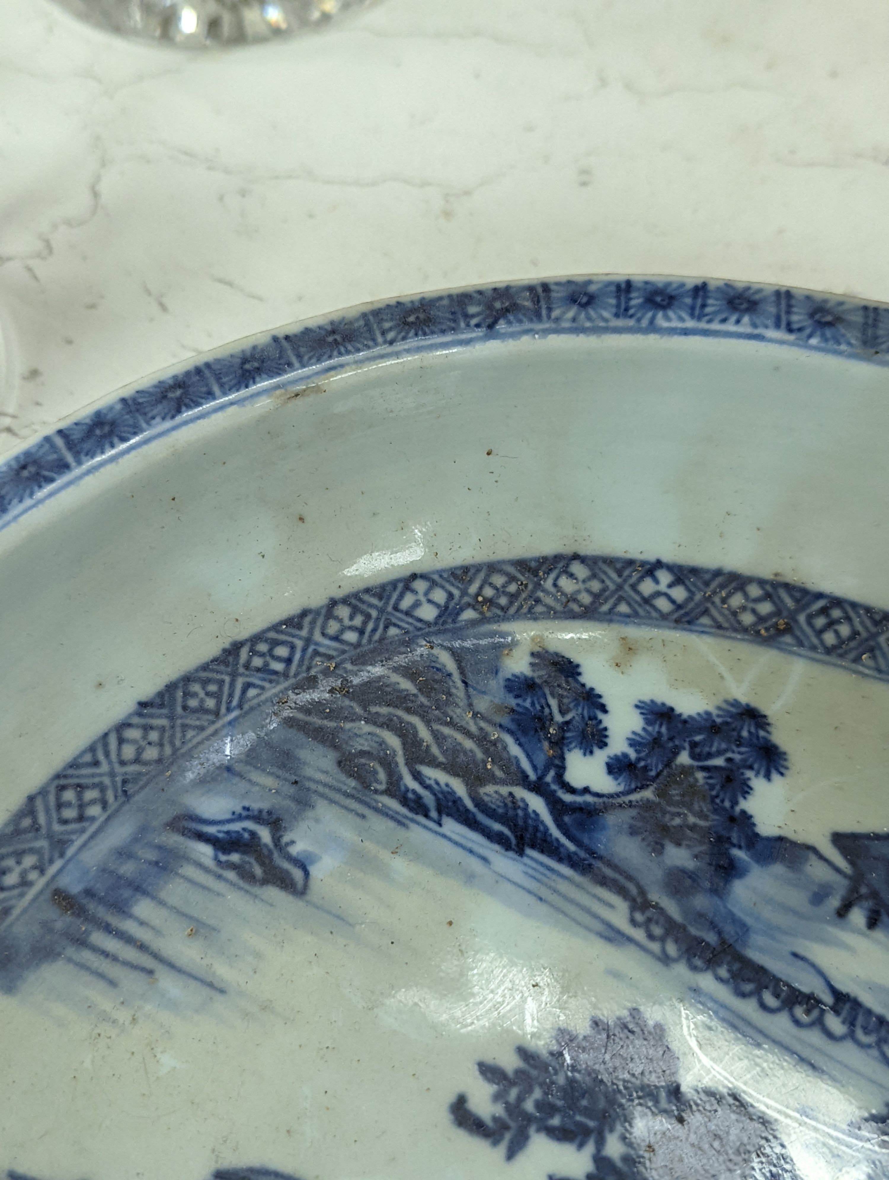 An 18th century Chinese export oval blue and white dish, 32cm.